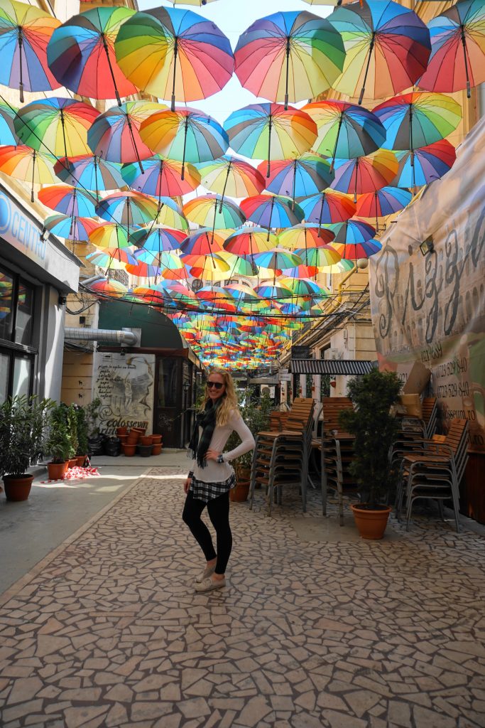 Pasajul Victoria in Bucharest, Romania 3 day itinerary - a colorful street with umbrellas