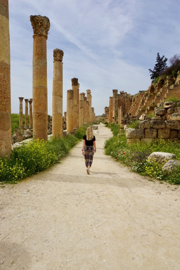 wandering away from the camera amidst the ruins of Jerash, Jordan