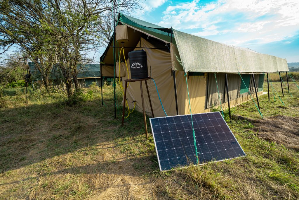 tented safari camps - how the shower works with the bucket and solar panels