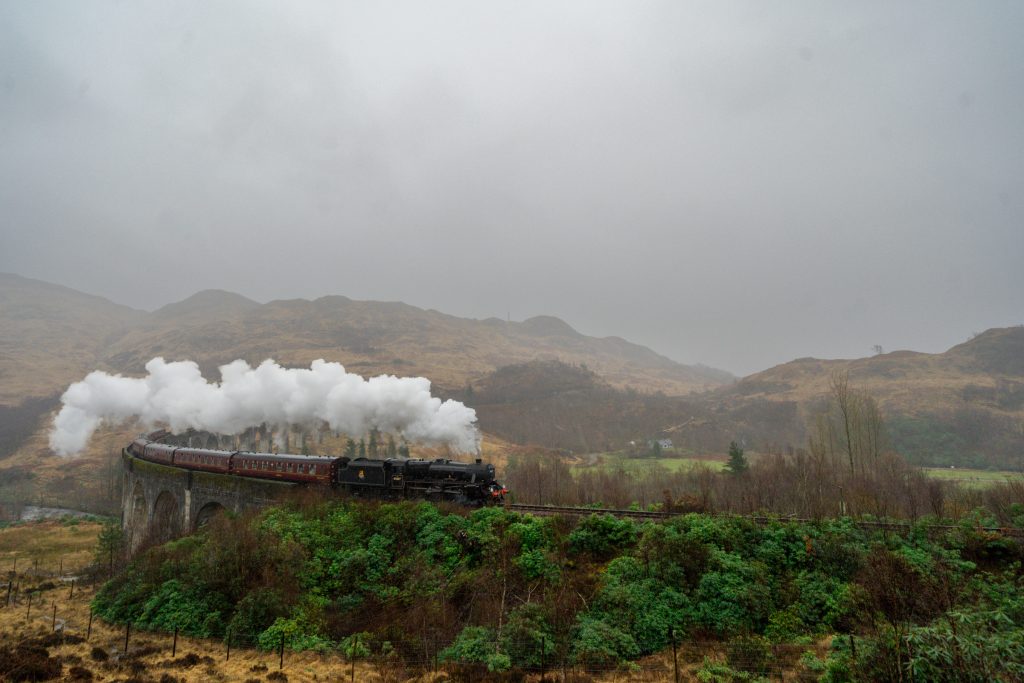 Glenfinnan Viaduct Harry Potter Train steaming through the Scottish Highlands